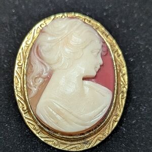Vintage oval cameo brooch Pin carved profile woman in cream pink backdrop gold